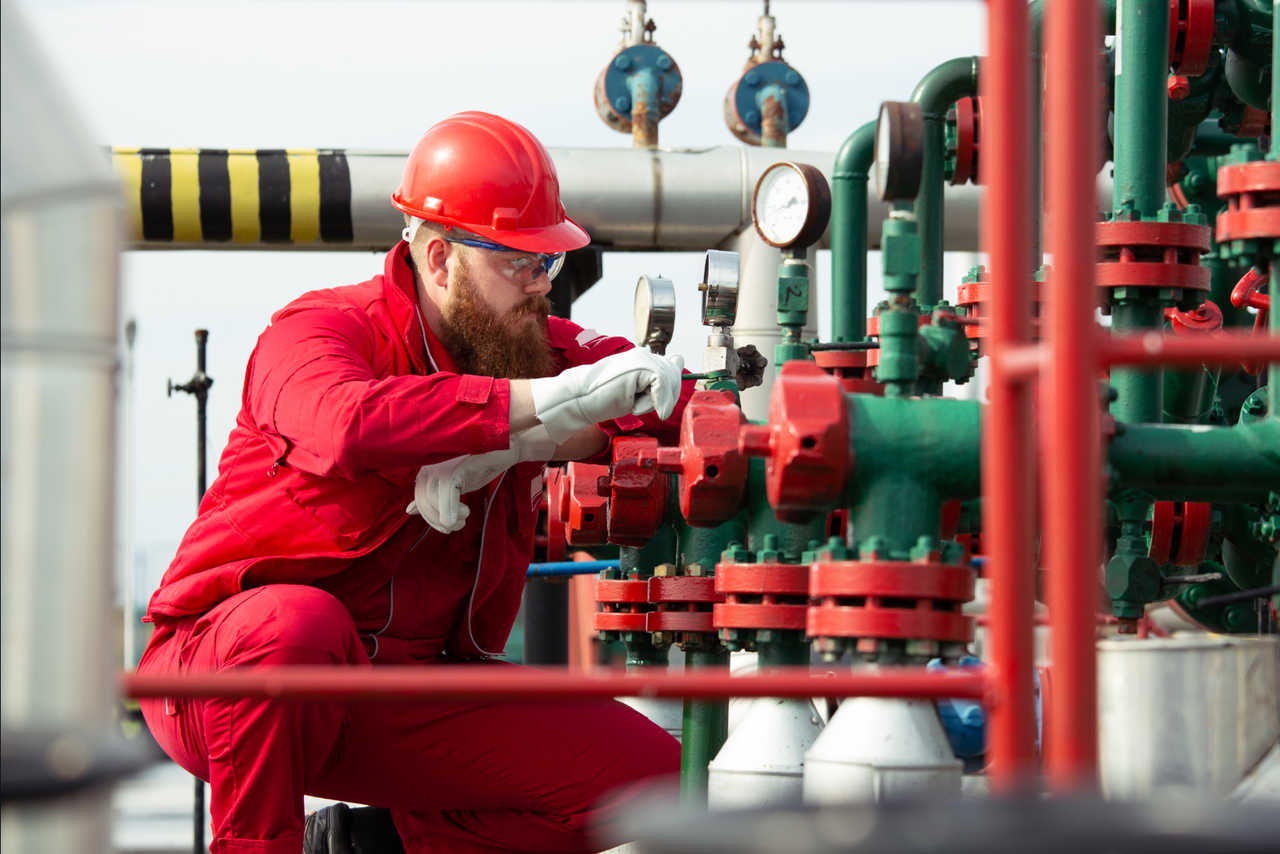 An engineer working on industrial equipment
